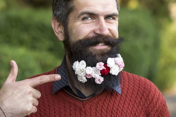 Man with flowers on beard
