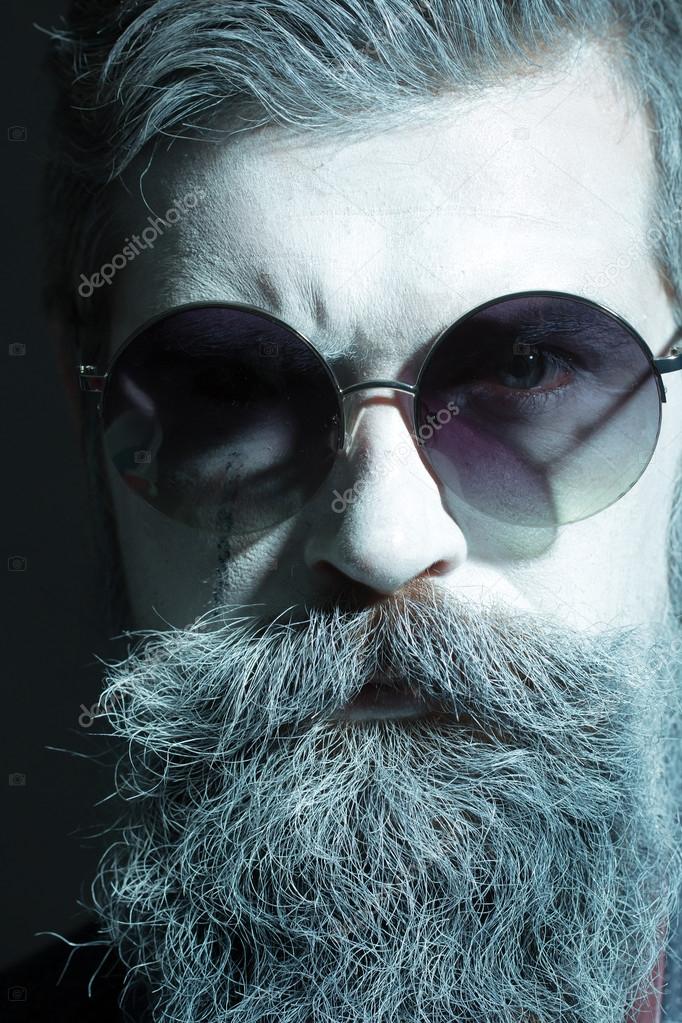 Man with beard in sun glasses