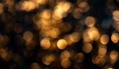 Altın arkaplan soyut parıltı dokusu. Altın arkaplan parıldayan metalik yüzey. Altın arka plan prim şablonu. Altın arka plan şenlikli ışıklar