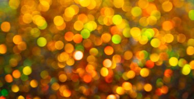 Altın parıltılar parıldıyor. Işıltılı altın bir arka plan. Parlak altın. Parlak altın parıltılı pankart. Soyut altın parıltı tasarımı. Parlak altın dokular. Parlak kıvılcım cazibeyle örtüşür