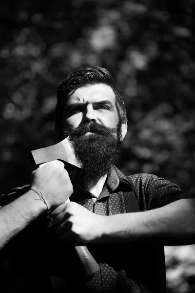 Man holding one axe — Stock Photo, Image