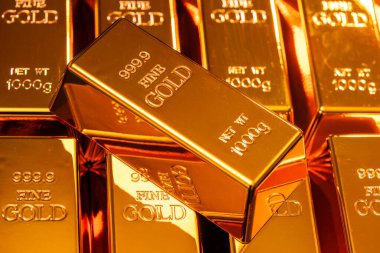 Gold bar macro texture background. Gold bullion precious metal asset. Gold financial investment market value. Gold safe reserve wealth concept