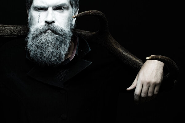 Man holding antlers