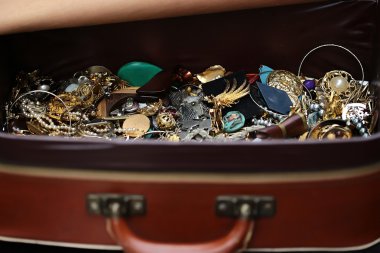 Different fashion bijouterie in suitcase