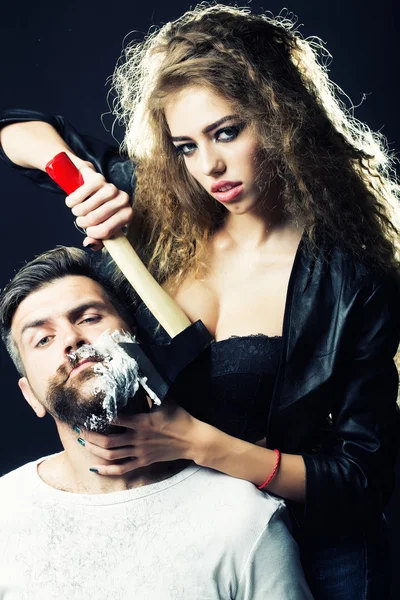 Woman shaving man — Stock Photo, Image