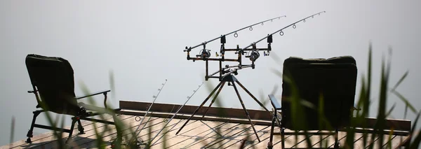 Two portative armchairs with fishing rods — Stock Photo, Image