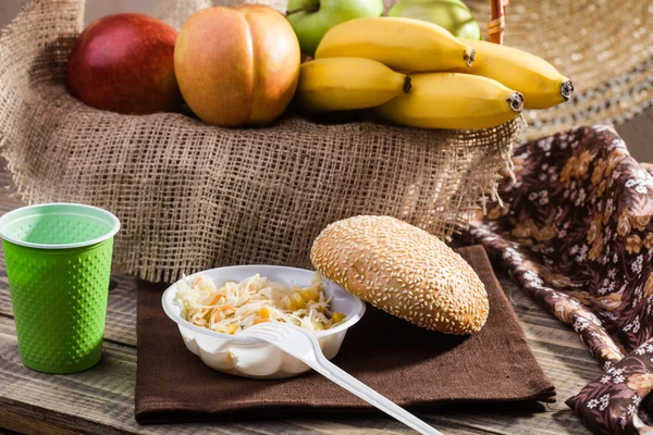 Fruits and salad with bun — Stock Photo, Image