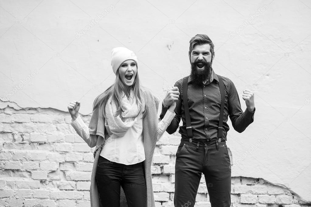 Emotional couple near wall