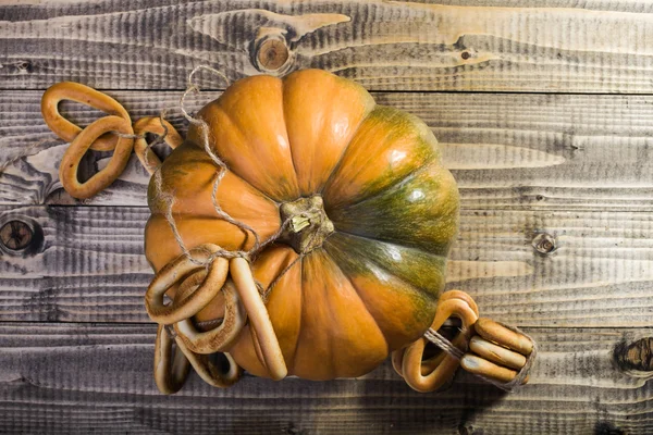 Pumpkin with bunches of cracknels — Stock Photo, Image