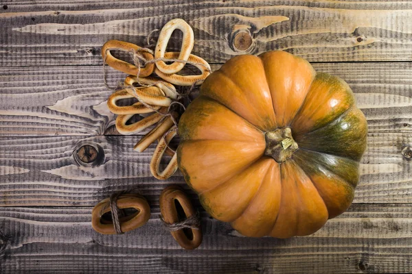 Pumpkin with bunches of cracknels — Stock Photo, Image