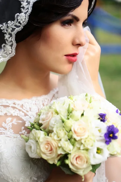 Bride with flowers — Stock Photo, Image