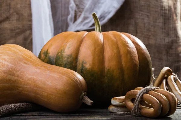 Pumpkins and bunches of cracknels — Stock Photo, Image