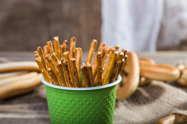 Disposable cup with stick biscuits — Stockfoto