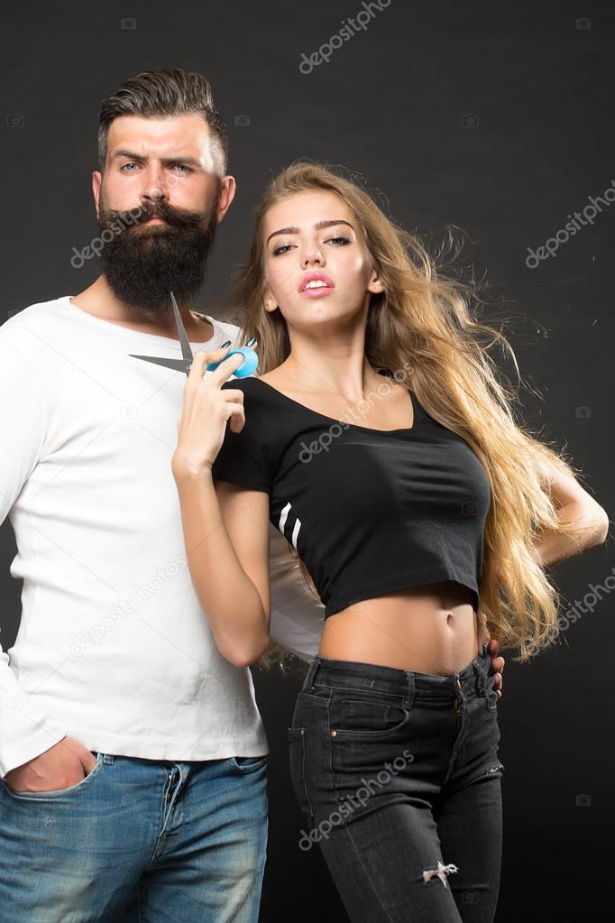 Man and woman with scissors