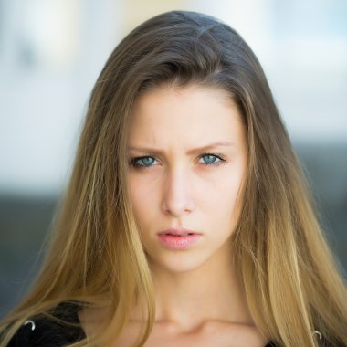 Portrait of serious pretty girl