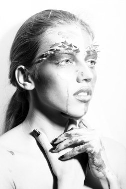 Pensive painted woman