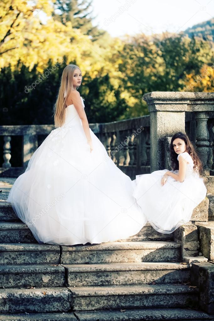 Bride with girl on stairs 