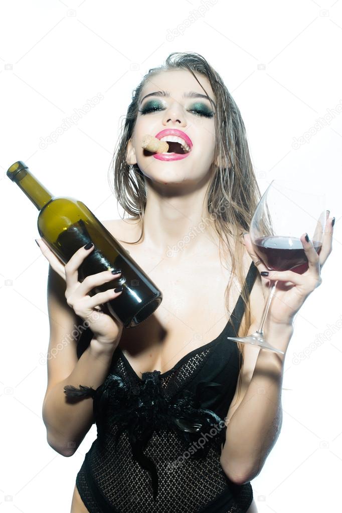 Woman with wine bottle and glass