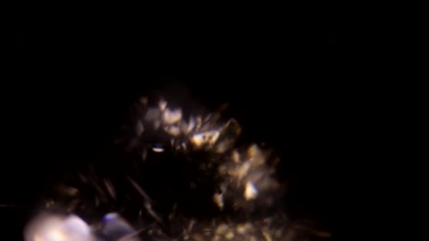 Facets of the diamond shimmer color on a black background — Stockvideo