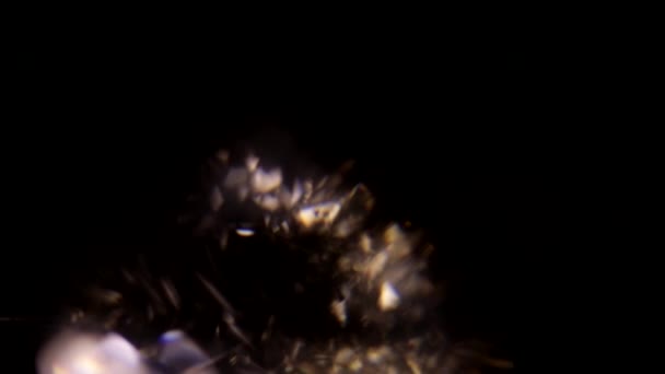 Facets of the diamond shimmer color on a black background — Stock video