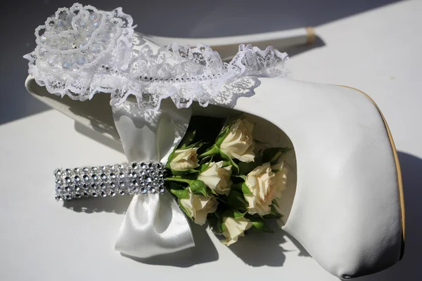 Wedding buttonhole bouquet and shoe — Stok fotoğraf