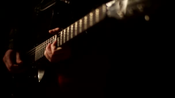 Man playing guitar on black background — Stock Video