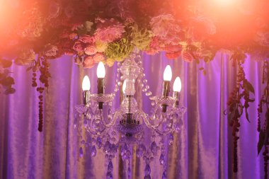 Cut-glass chandelier and decorated arch