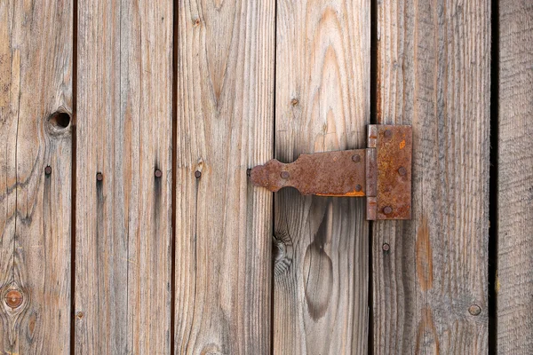 Butt on old wooden gate — Stock Photo, Image