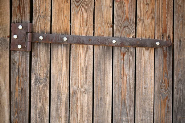 Butt on old wooden gate — Stock Photo, Image