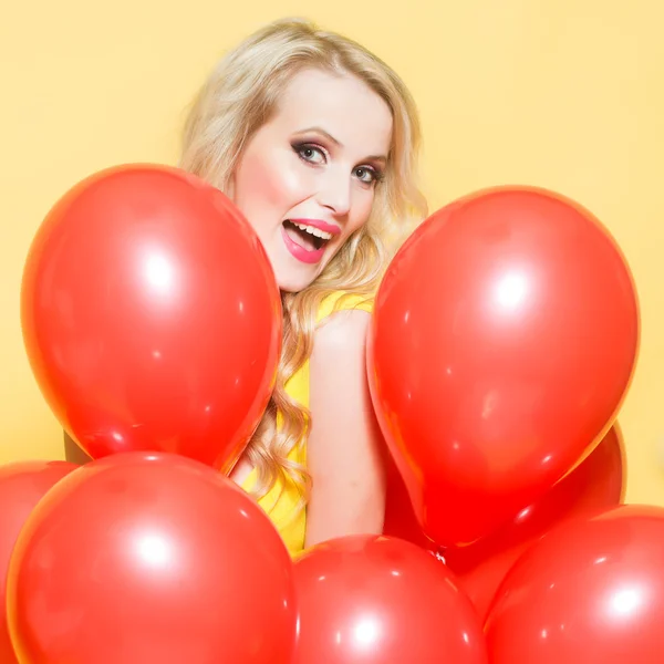 Woman in many balloons — Stock Photo, Image