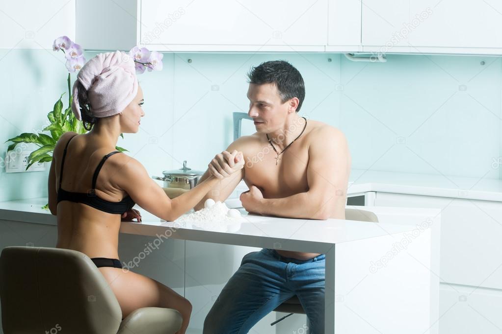 Arm wrestling of sexy couple