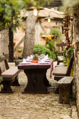Table set in cottage yard