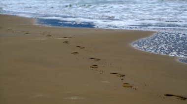 Feet prints on beautiful beach