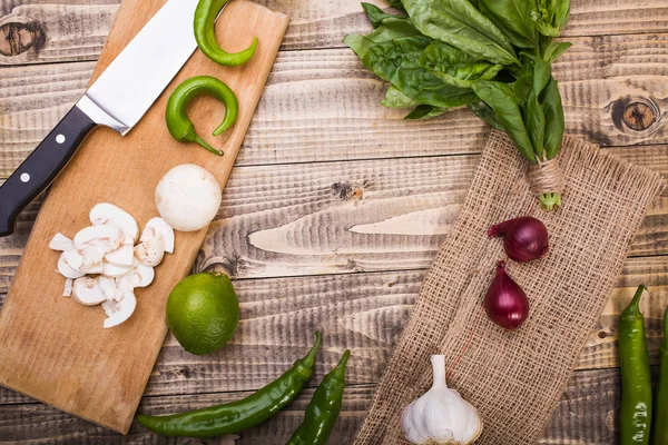 Vegetables, knife and board