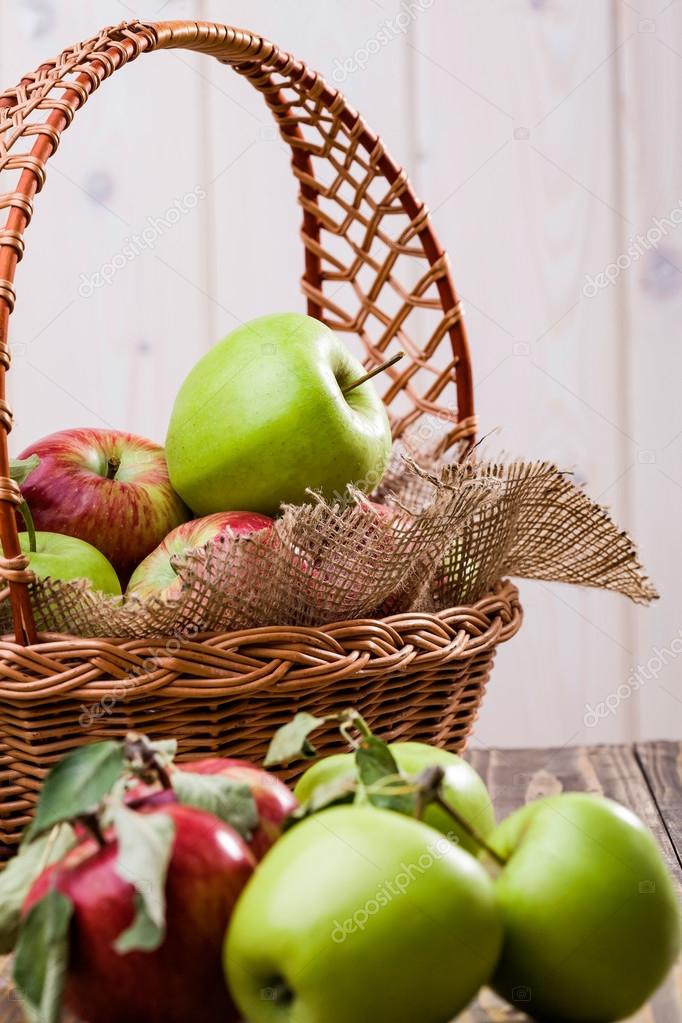 Group of apples near basket — Stock Photo © 95574786
