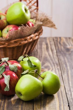 Fresh apples near basket
