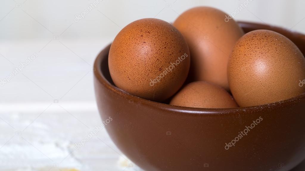 Fresh raw eggs in plate