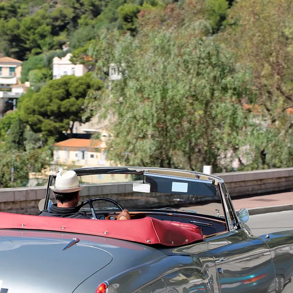 Man driving elegant retro convertible — Stock Photo, Image