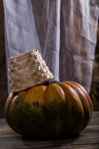 Pumpkin with basket — Stock Photo, Image