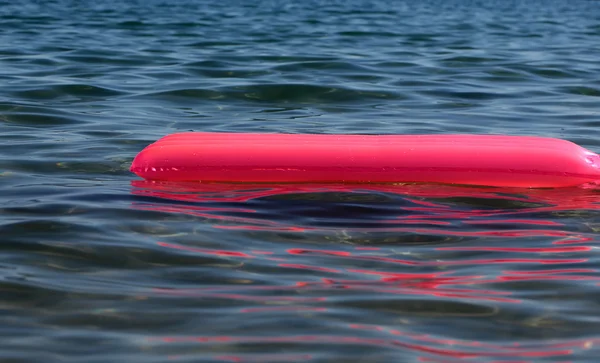 One pink inflatable air mattress