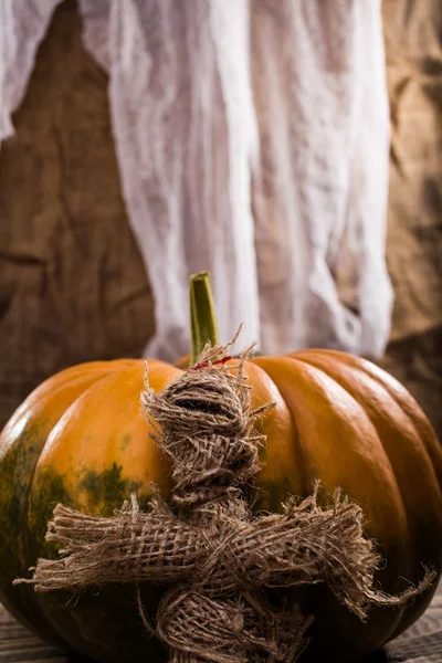 Wizard doll near pumpkin — Stock Photo, Image