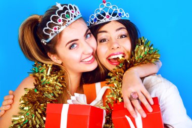 girls holding bright gifts and presents