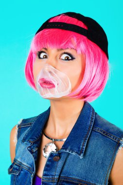 cheerful woman inflating the bubble gum