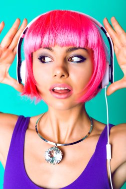 woman in pink wig and earphones