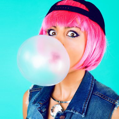 cheerful woman inflating the bubble gum