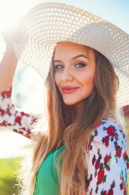 sunny portrait of smiling blonde girl