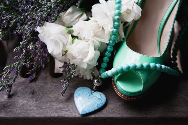 green female shoes, flowers and necklace clipart