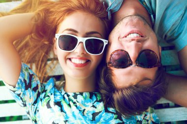 Close up sunny portrait of happy couple
