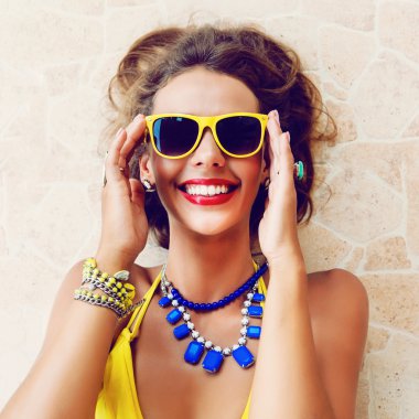 woman wearing stylish bikini and sunglasses