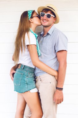 blonde kissing on cheek her boyfriend